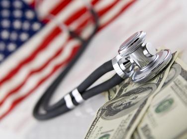 American flag, stethoscope, and money