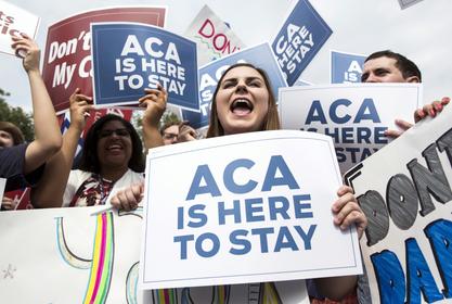 Supporters of the Affordable Care Act celebrate after the Supreme Court ruled in favor of the Obama administration, Washington, DC, June 25, 2015