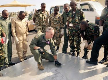 U.S. Senior Master Sgt. Leonard discusses cargo pallet inspection procedures with East Africa air force members during African Partnership Flight-Djibouti February 10, 2015