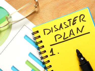 A notepad with a heading Disaster Plan