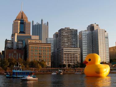 A 40-foot-high inflatable rubber duck, created by Dutch artist Florentijn Hofman, is towed up the Allegheny River in Pittsburgh, Pennsylvania, September 2013