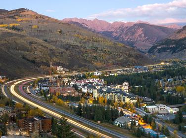 I-70 winding around Vail, Colorado with mountains in the distance