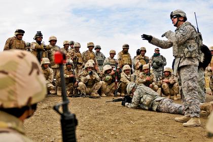 U.S. Army Sgt. instructing Iraqi soldiers on individual movement techniques during a class at the Ghuzlani Warrior Training Center in 2011
