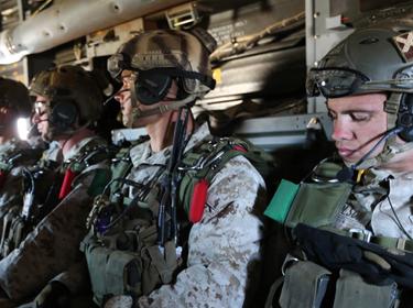 Marines prepare to jump using a static line