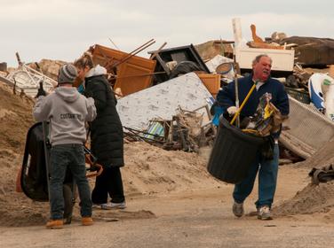 Volunteers assist with the clean up efforts in Sea Bright, NJ, after Hurricane Sandy