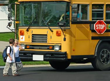 boys exiting a school bus