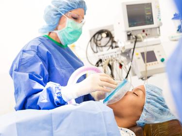 Anesthesiologist sedating a patient before surgery