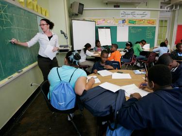 Teacher Darcy McKinnon teaches math to her seventh grade class at Samuel J. Green Charter School in New Orleans, Louisiana, February 22, 2006