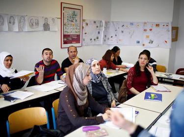 Migrants attend a lesson at the 'institute for intercultural communication' in Berlin, Germany, April 13, 2016
