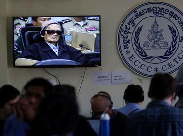 Former Khmer Rouge leader Nuon Chea is seen on a television screen as he waits for a verdict in Phnom Penh, Cambodia, November 16, 2018