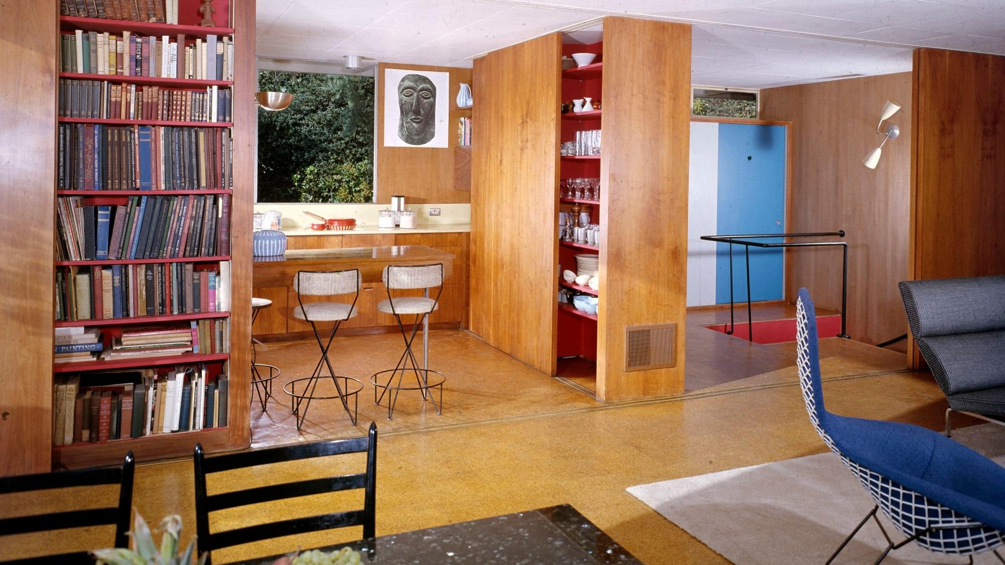 The Wohlstetters' main residence included a bookcase that slid into the wall, revealing the kitchen, photo by Julius Shulman/J. Paul Getty Trust