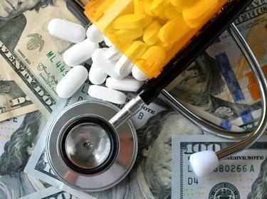 Health care spending, money, medication, stethoscope