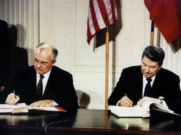 U.S. President Ronald Reagan (R) and Soviet President Mikhail Gorbachev sign the Intermediate-Range Nuclear Forces (INF) treaty in the White House, Washington, DC, December 8, 1987, photo by Str Old/Reuters