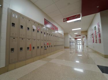 Hallways are empty during school closures in an effort to curb the spread of the coronavirus, in Milton-Union Exempted Village School District in West Milton, Ohio, March 13, 2020, photo by Kyle Grillot/Reuters