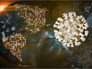 Polygonal image of COVID-19 virus superimposed on a digital world map, photo by Andrii Pokliatskyi/Getty Images