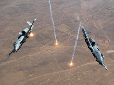 Two USAF A-10 Thunderbolt IIs release countermeasure flares over the U.S. Central Command area of responsibility, July 23, 2020, photo by Staff Sgt. Justin Parsons/U.S. Air Force