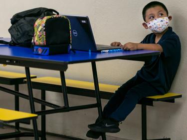 A child attends Miami Community Charter School for the first day of class in Flagler City, Florida, August 31, 2020, photo by Matias J. Ocner/Miami Herald/TNS/ABACA/Reuters