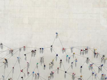 Bird's eye view of a crowd, connected to one another by lines, photo by Orbon Alija/Getty Images