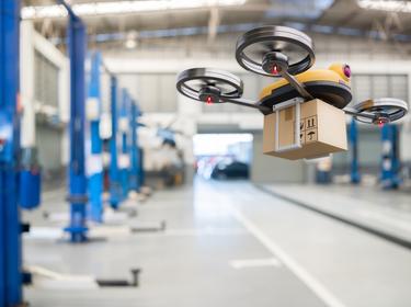 Spare part delivery drone at garage storage in leading automotive car service center for delivering mechanical shipping component part assembling to customeSpare part delivery drone at garage storage in leading automotive car service center for delivering mechanical shipping component part assembling to customer, photo by Shutter2U/Getty Images