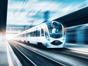 High speed train at the railway station at sunset, photo by den-belitsky/Adobe Stock