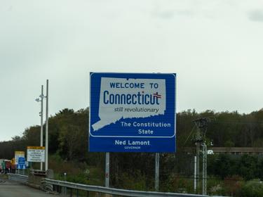 Welcome to Connecticut highway sign, photo by Rabbitti/Getty Images