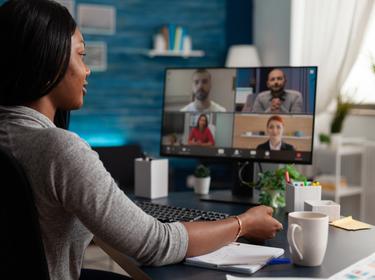 Woman talking to workmates on online conference, photo by Dragos Condrea/Adobe Stock