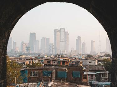 Contrast between poverty and wealth in Mumbai, India, photo by Olivia/Adobe Stock