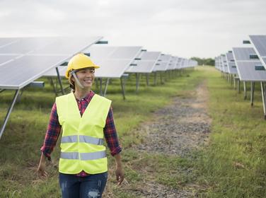 Female engineer reviewing maintenance of solar cells, photo by Johnstocker/Adobe Stock 