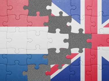 Puzzle with flags of Netherlands and the UK, photo by luzitanija/Adobe Stock