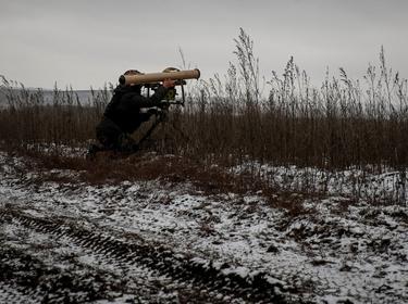 A Ukrainian service member prepares an anti-tank guided missile weapon system on a frontline near Soledar in Donetsk region, Ukraine, January 14, 2023, photo by Serhii Nuzhnenko/Reuters