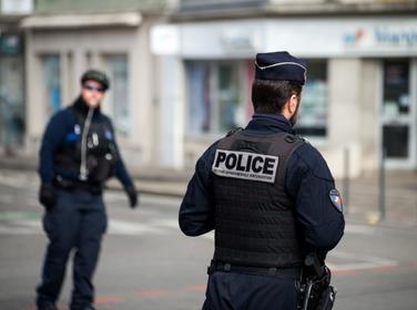 Mulhouse - France - 17 March 2022 - Portrait on back view of french national policeman standing in the street for the traffic circulation, photo by pixarno/Adobe Stock 
