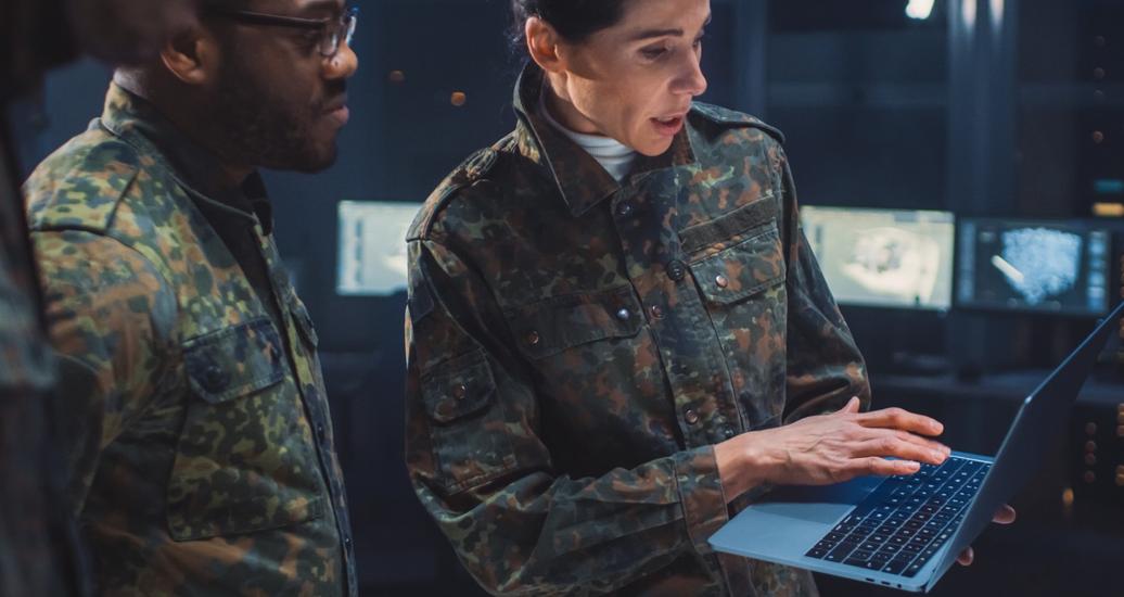 Military personnel meeting in computing facility, photo by Gorodenkoff Productions OU/Adobe Stock