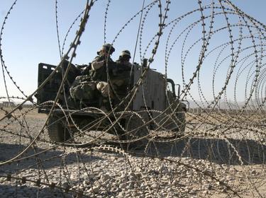 U.S. Army soldiers leave their base to patrol the area in Zormat, Afghanistan, October 4, 2004, photo by Reuters Photographer/Reuters